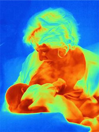 Mature woman breastfeeding newborn son, thermal image Stock Photo - Premium Royalty-Free, Code: 614-08874932