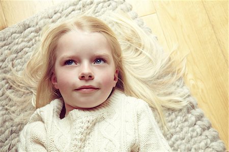 simsearch:614-06043612,k - Young girl lying on rug Stock Photo - Premium Royalty-Free, Code: 614-08875634