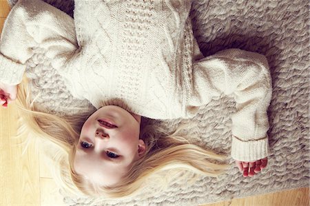 simsearch:614-06043612,k - Young girl lying on rug Stock Photo - Premium Royalty-Free, Code: 614-08875635