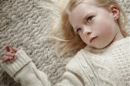 simsearch:614-06043612,k - Young girl lying on rug Stock Photo - Premium Royalty-Free, Code: 614-08875637