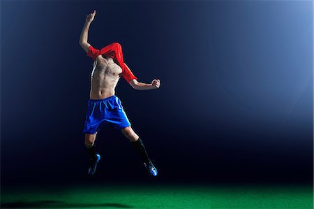 simsearch:614-07239995,k - Male soccer player celebrating with shirt over head Stock Photo - Premium Royalty-Free, Code: 614-08875705