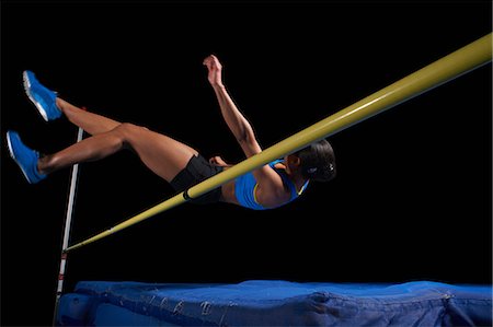 sports venue - Young female athlete doing high jump Stock Photo - Premium Royalty-Free, Code: 614-08875901