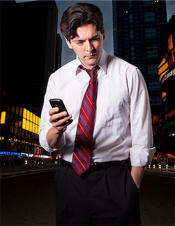 simsearch:400-05388090,k - Stressed businessman in city with smartphone Stock Photo - Premium Royalty-Free, Code: 614-08876035