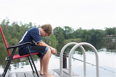 photos of little boy fishing - Portrait of boy fishing, Shalimar, Florida, USA Foto de stock - Sin royalties Premium, Código: 614-08876319