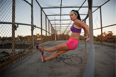 simsearch:649-04247797,k - Female jogger stretching on walkway Stock Photo - Premium Royalty-Free, Code: 614-08876331