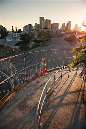 simsearch:614-08307669,k - Female athlete running up curved walkway Stock Photo - Premium Royalty-Free, Code: 614-08876332