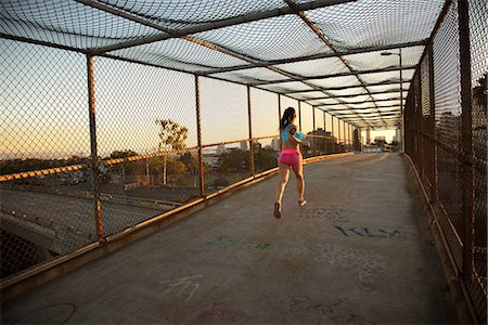 simsearch:633-01715682,k - Female jogger running on walkway Stock Photo - Premium Royalty-Free, Code: 614-08876333