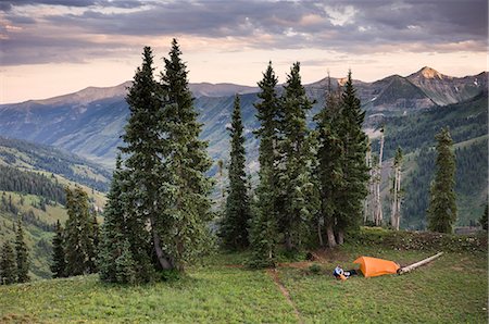 Woman camping near Paradise Divide, Indian Peaks Wilderness, Colorado, USA Stock Photo - Premium Royalty-Free, Code: 614-08876565