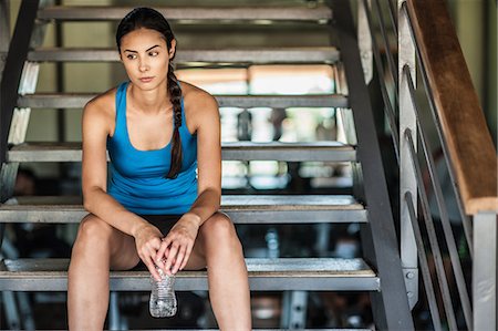 simsearch:6113-07790833,k - Young woman sitting on stairs with water bottle Stock Photo - Premium Royalty-Free, Code: 614-08876698