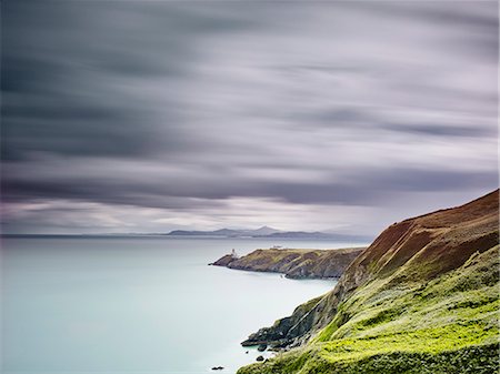 View of baily lighthouse on distant peninsula, Howth, Dublin Bay, Republic of Ireland Stock Photo - Premium Royalty-Free, Code: 614-08876773