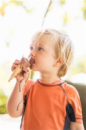 energy consumption - Boy enjoying ice cream cone Stock Photo - Premium Royalty-Free, Code: 614-08877164