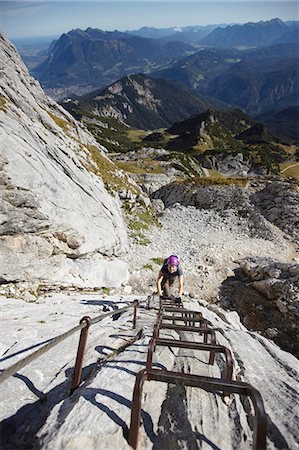 simsearch:693-06667811,k - Mature woman climbing Alpspitze via ferrata, elevated view, Garmisch-Partenkirchen, Bavaria, Germany Stock Photo - Premium Royalty-Free, Code: 614-08877191