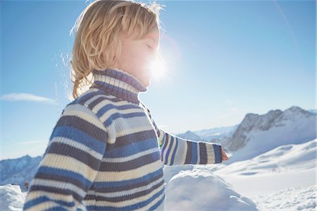 simsearch:614-06896861,k - Young boy walking in snowy landscape, low angle view Stock Photo - Premium Royalty-Free, Code: 614-08877224
