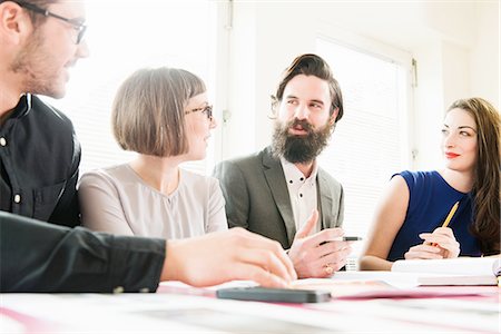 Colleagues in discussion Stock Photo - Premium Royalty-Free, Code: 614-08877385
