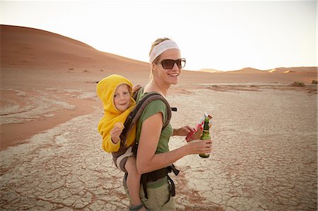 Mother and son on sand dune, Namib Naukluft National Park, Namib Desert, Sossusvlei, Dead Vlei, Africa Stock Photo - Premium Royalty-Free, Code: 614-08877464