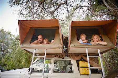 smile woman 40s - Family in sleeping tents on top of off road vehicle, Ruacana, Owamboland, Namibia Stock Photo - Premium Royalty-Free, Code: 614-08877480