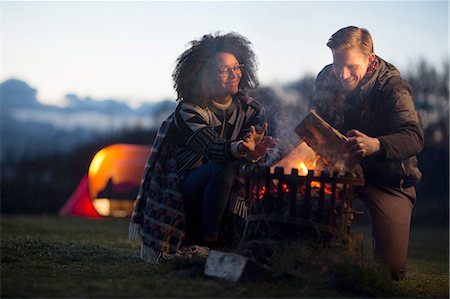 simsearch:614-08119553,k - Couple toasting marshmallows at camp, Isle of Skye, Scotland Stock Photo - Premium Royalty-Free, Code: 614-08877565