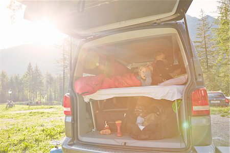 simsearch:614-06897023,k - Mother and two sons waking up in camper van, Lake Toblach, Dolomites, South Tyrol, Italy Stock Photo - Premium Royalty-Free, Code: 614-08877611