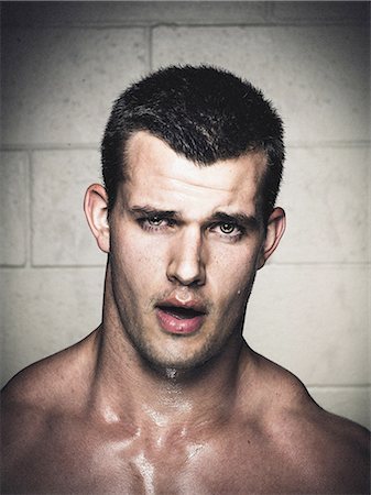 Portrait of sweaty young man with open mouth after crossfit training Stock Photo - Premium Royalty-Free, Code: 614-08877630