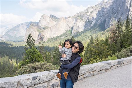 Mature woman carrying granddaughter, Yosemite National Park, California, USA Stock Photo - Premium Royalty-Free, Code: 614-08877729