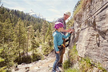 Father and child rock climbing, Ehrwald, Tyrol, Austria Stock Photo - Premium Royalty-Free, Code: 614-08877950