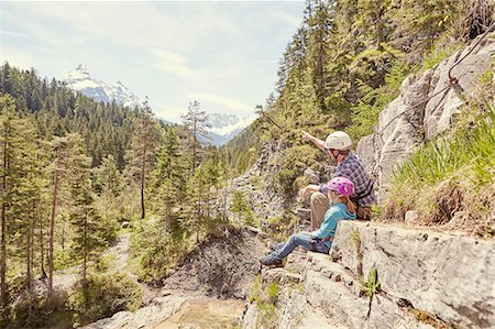 Father and child enjoying view on hill, Ehrwald, Tyrol, Austria Stock Photo - Premium Royalty-Free, Code: 614-08877951