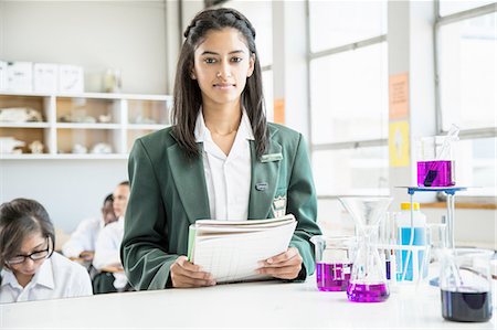 simsearch:614-02984826,k - Student in lab, classmates in background Stock Photo - Premium Royalty-Free, Code: 614-08878760