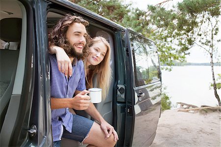 simsearch:614-09078761,k - Young couple relaxing in van by lake Stock Photo - Premium Royalty-Free, Code: 614-08878956