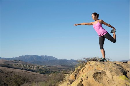 simsearch:614-06168927,k - Mature woman practicing yoga tree pose on top of hill, Thousand Oaks, California, USA Stock Photo - Premium Royalty-Free, Code: 614-08879158