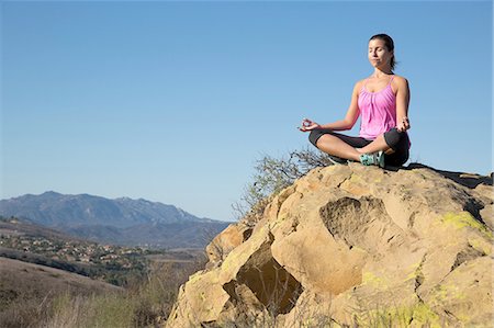 simsearch:614-06168927,k - Mature woman practicing yoga lotus pose on hill, Thousand Oaks, California, USA Stock Photo - Premium Royalty-Free, Code: 614-08879159