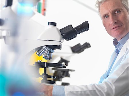 simsearch:6113-07589172,k - Scientist using microscope in lab Stock Photo - Premium Royalty-Free, Code: 614-08870252