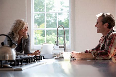 Older couple relaxing in kitchen Stock Photo - Premium Royalty-Free, Code: 614-08870695