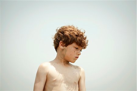 Bare-chested boy standing outdoors Stock Photo - Premium Royalty-Free, Code: 614-08870780