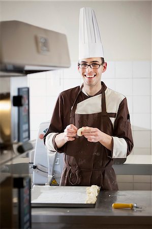 simsearch:649-06165027,k - Baker shaping dough in kitchen Stock Photo - Premium Royalty-Free, Code: 614-08871096