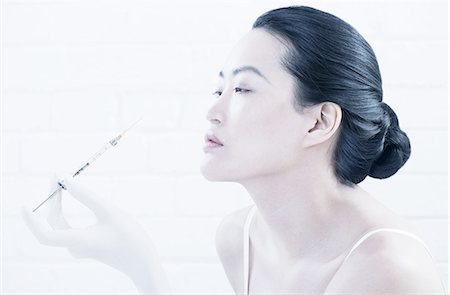 simsearch:614-06896619,k - Woman having Botox injection in face Foto de stock - Sin royalties Premium, Código: 614-08871385