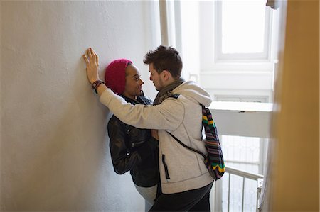 simsearch:614-06896801,k - Young couple hugging in hallway Stock Photo - Premium Royalty-Free, Code: 614-08871660