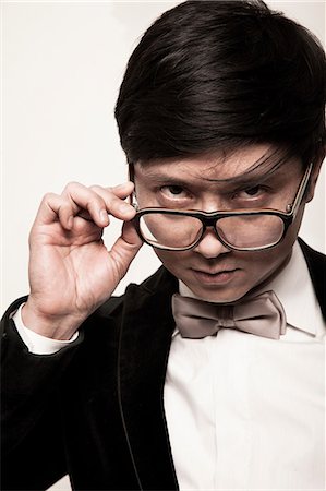simsearch:614-06813654,k - Portrait of man peering over glasses Foto de stock - Sin royalties Premium, Código: 614-08871674