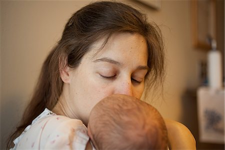 pictures of mum and baby in hospital - Mother kissing newborn baby boy Stock Photo - Premium Royalty-Free, Code: 614-08871995