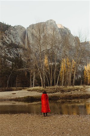 simsearch:614-05557077,k - Rear view of woman wrapped in red blanket looking out at mountain, Yosemite National Park, California, USA Stock Photo - Premium Royalty-Free, Code: 614-08880784