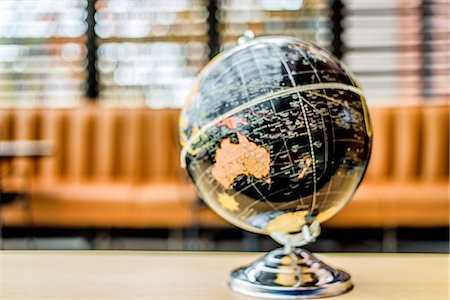 Globe on table Stock Photo - Premium Royalty-Free, Code: 614-08926385