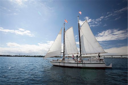 sailing - Group of friends on sailing boat on water Stock Photo - Premium Royalty-Free, Code: 614-08946269