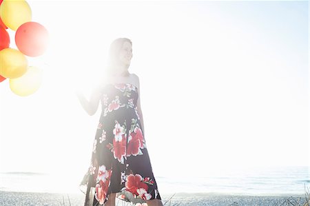 pregnant low angle - Pregnant woman with balloons, Cape Town, South Africa Stock Photo - Premium Royalty-Free, Code: 614-08984159