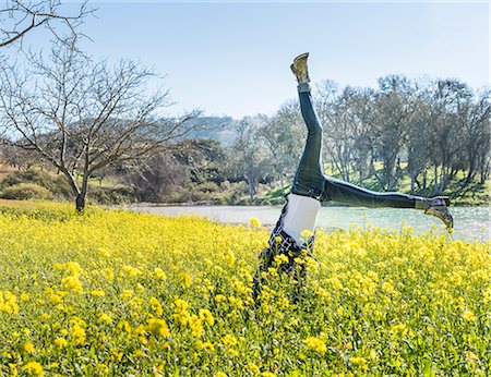 simsearch:614-08065889,k - Mature woman doing cartwheel in field of wild flowers, Paso Robles, California, USA Stock Photo - Premium Royalty-Free, Code: 614-08982720