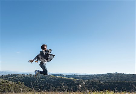 simsearch:614-08065889,k - Mature woman in rural setting, jumping for joy, Paso Robles, California, USA Stock Photo - Premium Royalty-Free, Code: 614-08982721