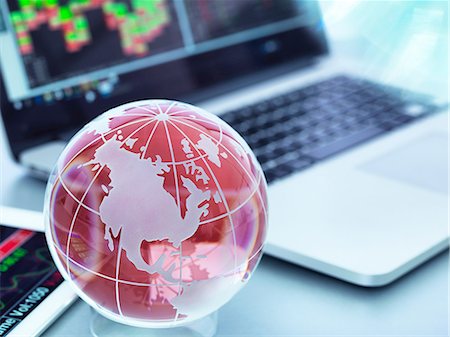 simsearch:700-05452103,k - Globe with digital tablet and laptop showing international business trade Stock Photo - Premium Royalty-Free, Code: 614-08982750