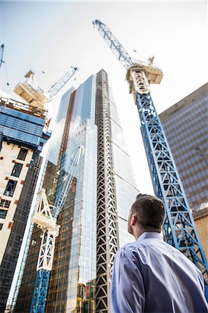 simsearch:614-06624685,k - Businessman looking up at building under construction, London, UK Fotografie stock - Premium Royalty-Free, Codice: 614-08983169