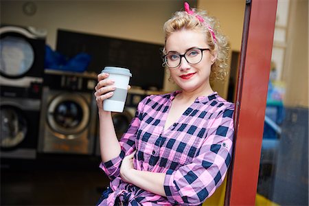 simsearch:614-09078761,k - Portrait of quirky woman leaning against laundrette door Stock Photo - Premium Royalty-Free, Code: 614-08983608