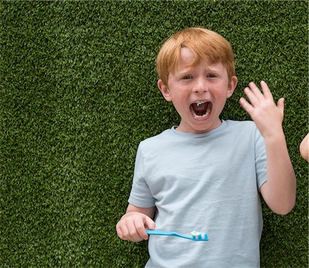 surprised kids - Upset boy brushing teeth Stock Photo - Premium Royalty-Free, Code: 614-08991133