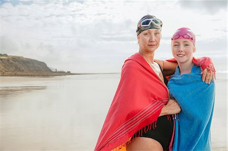 swimwear for mature women - Mother and daughter standing on beach with shawls, Folkestone, UK Stock Photo - Premium Royalty-Free, Code: 614-08991195