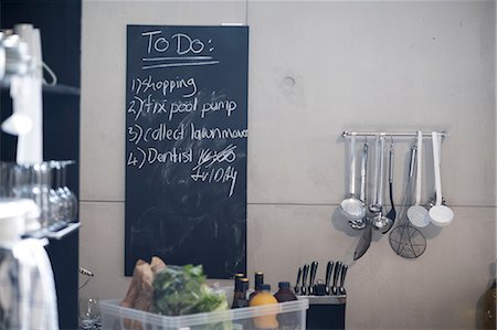 Blackboard in kitchen with list of things to do Stock Photo - Premium Royalty-Free, Code: 614-09017419